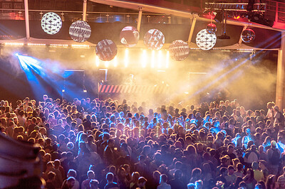 DJ and crowd at disco night.